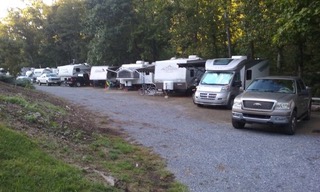 RVs parked in a row at dusk at Laurel Creek RV Park