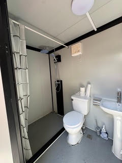 Inside one of the clean private bathhouse showers and restrooms