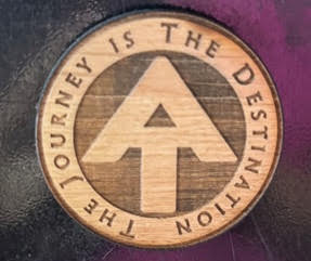 Wooden Appalachian Trail medallion reading The Journey Is The Destination